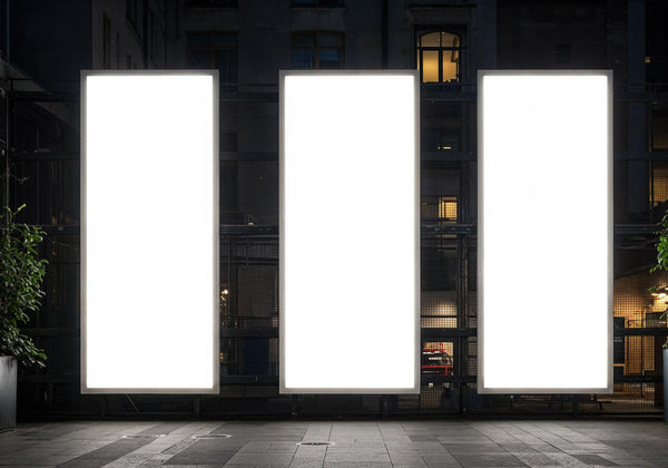Three Illuminated Vertical Billboards in Urban Night Setting JPG Mockup Image