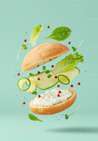 Fresh vegetable sandwich ingredients floating on blue