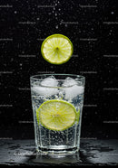 Refreshing sparkling water with lime and ice cubes