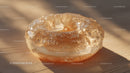 Luxurious Golden Glass Gemstone with Sparkling Glitter in Sunlight