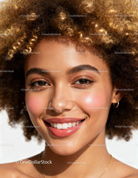 Close-up portrait of smiling woman with natural curly hair