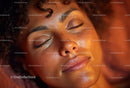 Close-Up of a Woman with Curly Hair and Glowing Skin in a Calm Mood