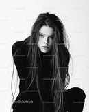 Black and White Portrait of Young Woman with Intense Gaze