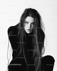 Black and White Portrait of Young Woman with Intense Gaze