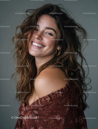 Joyful woman with curly hair and radiant smile