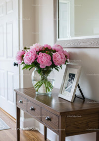 Beautiful Pink Peony Bouquet in Glass Vase on Wooden Console Table