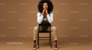 Confident Woman Sitting on Chair in Modern Studio Portrait