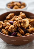 Close-up of Granola with Dried Fruit in Wooden Bowl