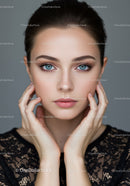 Elegant Young Woman with Bright Blue Eyes and Flawless Skin