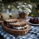 Rustic Bread Basket with Milk Jars and Daisy Flowers in Outdoor Setting