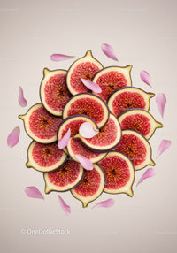 Fresh fig slices arranged with delicate flower petals