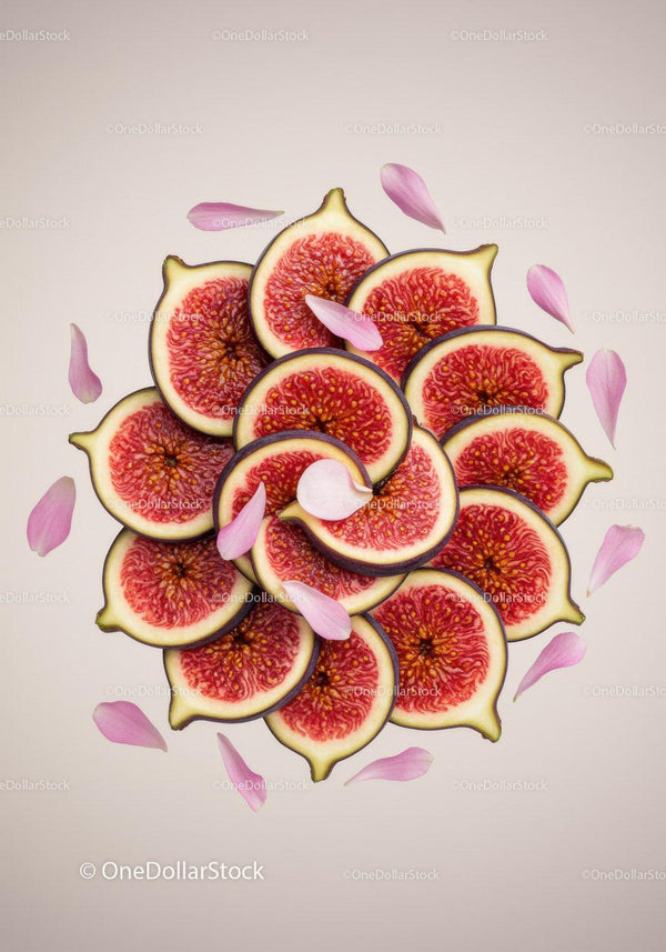 Fresh fig slices arranged with delicate flower petals