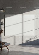 Minimalist interior with blank frame and modern chair