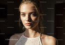 Elegant Young Woman in Natural Light with Sunlit Skin