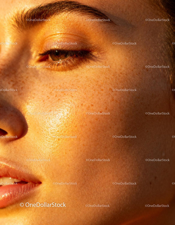 Close up of natural freckled skin glowing in sunlight