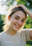 Beautiful Young Woman Smiling Outdoors Under Green Foliage