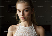 Young Woman in Lace Top with Elegant Style and Captivating Gaze