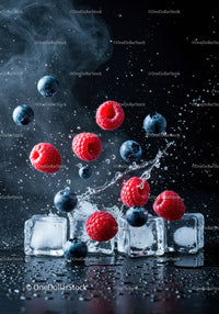 Fresh raspberries and blueberries splashing with ice cubes