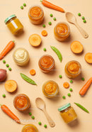 Fresh homemade vegetable purees with wooden spoons
