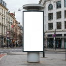 Blank vertical billboard on city street corner