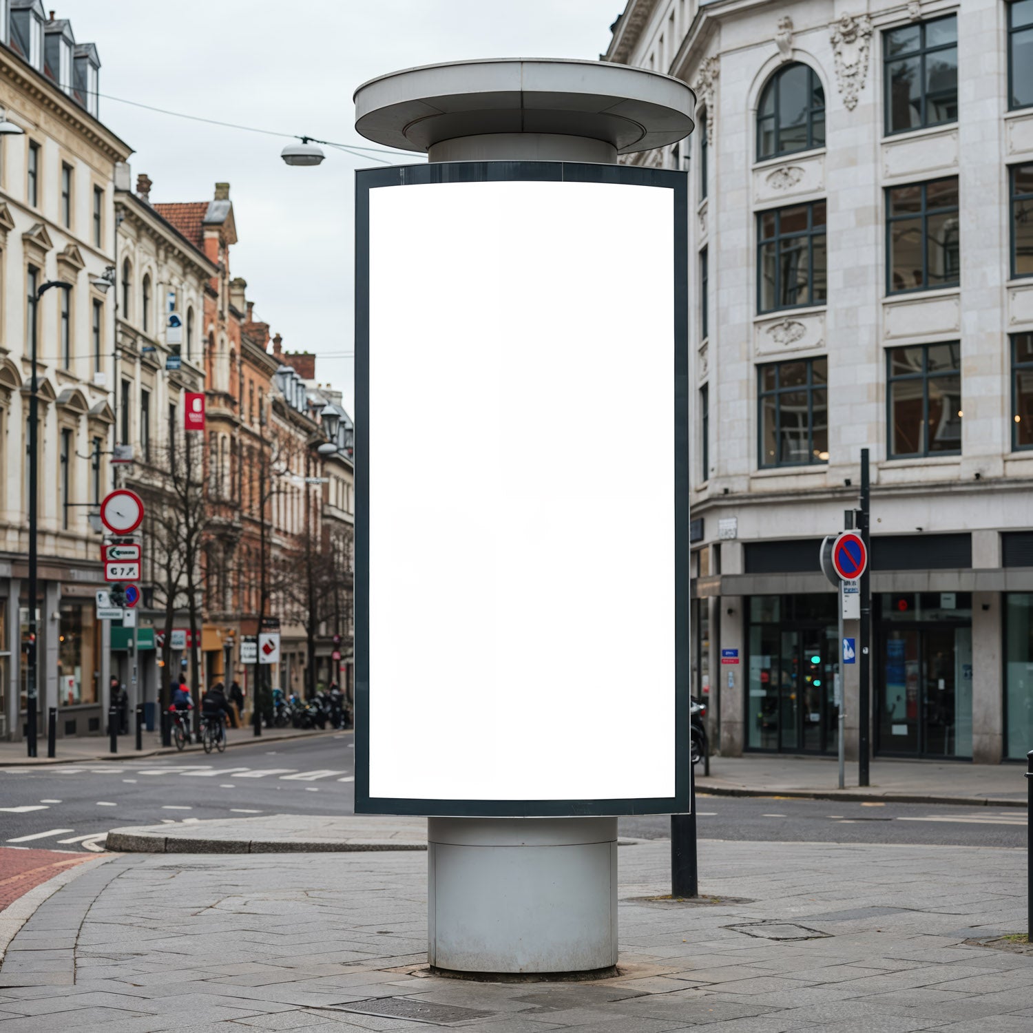 Blank vertical billboard on city street corner