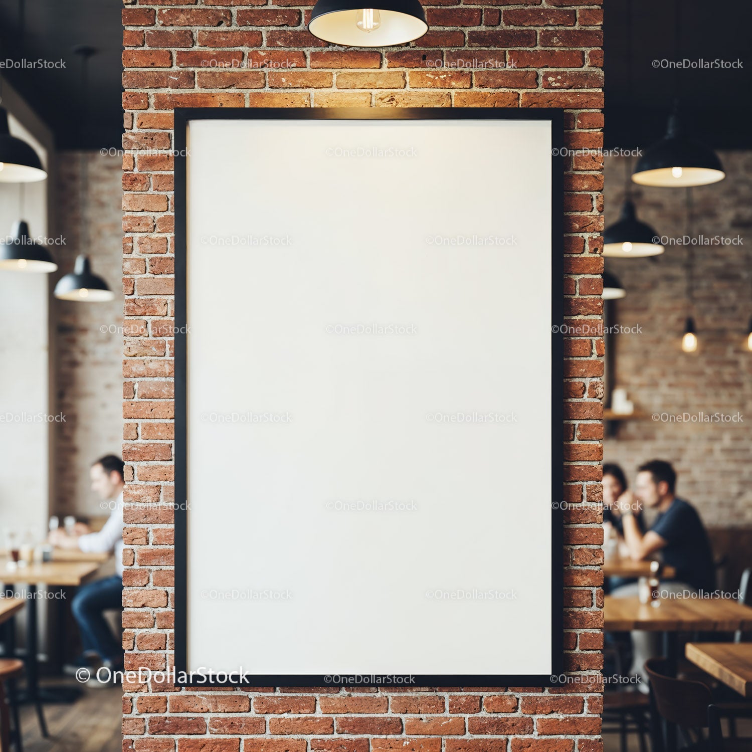 Blank poster frame on brick wall in modern cafe interior