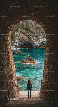 Woman with Backpack Exploring Turquoise Coastal Rock Formation and Sea