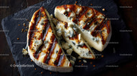 Artisan Blue Cheese Wheel on Dark Rustic Surface in Gourmet Food Setting
