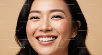 Close up of cheerful Asian woman smiling warmly