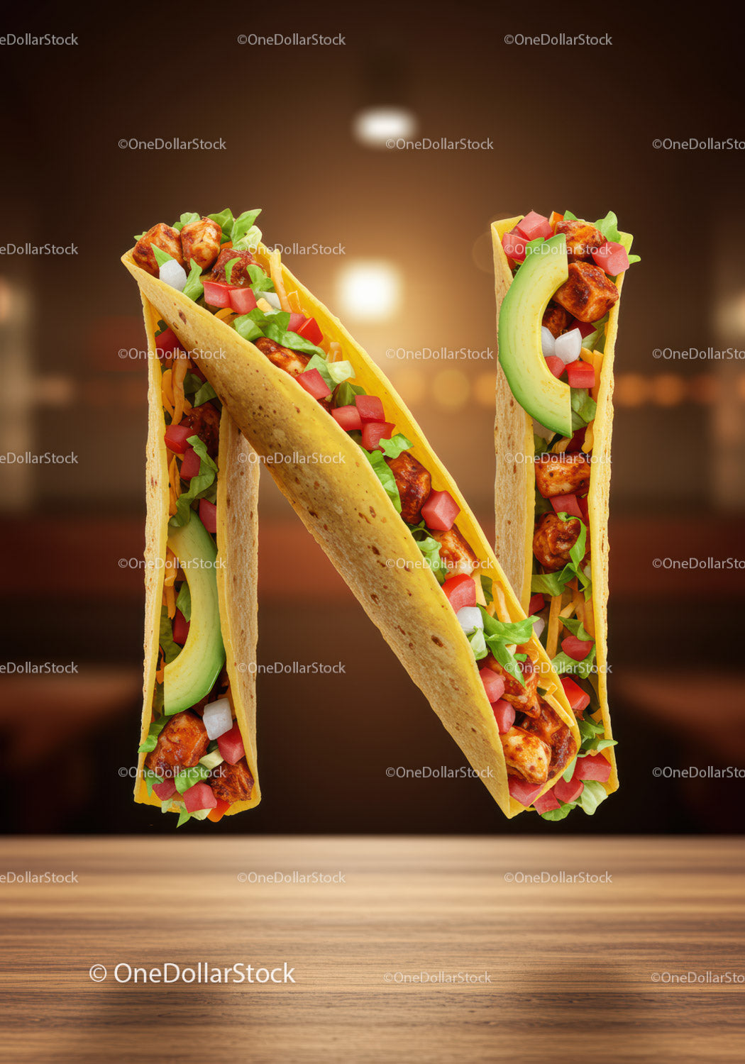 Letter N made of tasty chicken tacos with fresh toppings