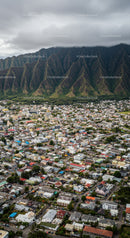 Urban Residential Area with Mountain Background Under Cloudy Sky