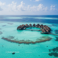 Overwater Bungalows on Turquoise Ocean with Cloudy Sky