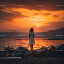Silhouette of a Child at Sunset by the Ocean Shore
