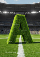 Giant Grass Letter A on Football Field with Stadium Lights