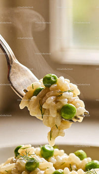 Creamy risotto with fresh green peas and herbs