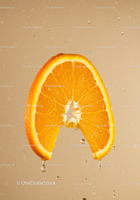 Juicy orange slice with water droplets on beige background