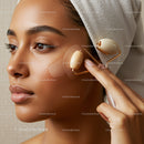 Close-up of a Woman Using a Jade Roller for Facial Massage