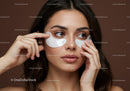 Young Woman Applying Under-Eye Patches for Skin Rejuvenation