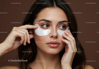 Young Woman Applying Under-Eye Patches for Skin Rejuvenation