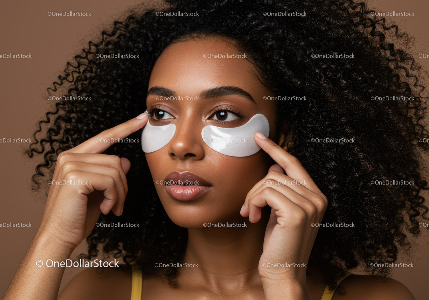 Beautiful Woman Applying Under Eye Patches for Skincare Treatment