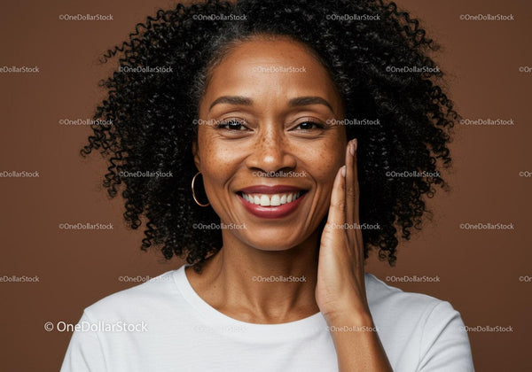 Close-up of Smiling Woman with Curly Hair and Warm Background