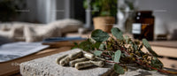 Herbs and Supplements on Stone with Green Eucalyptus Leaves