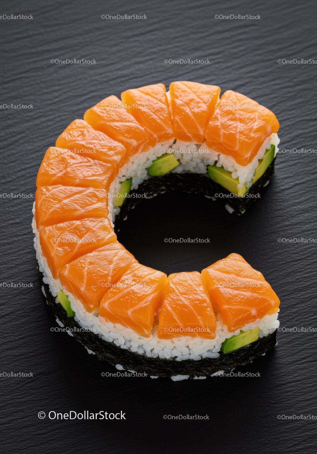 Fresh salmon sushi ring with avocado on black plate