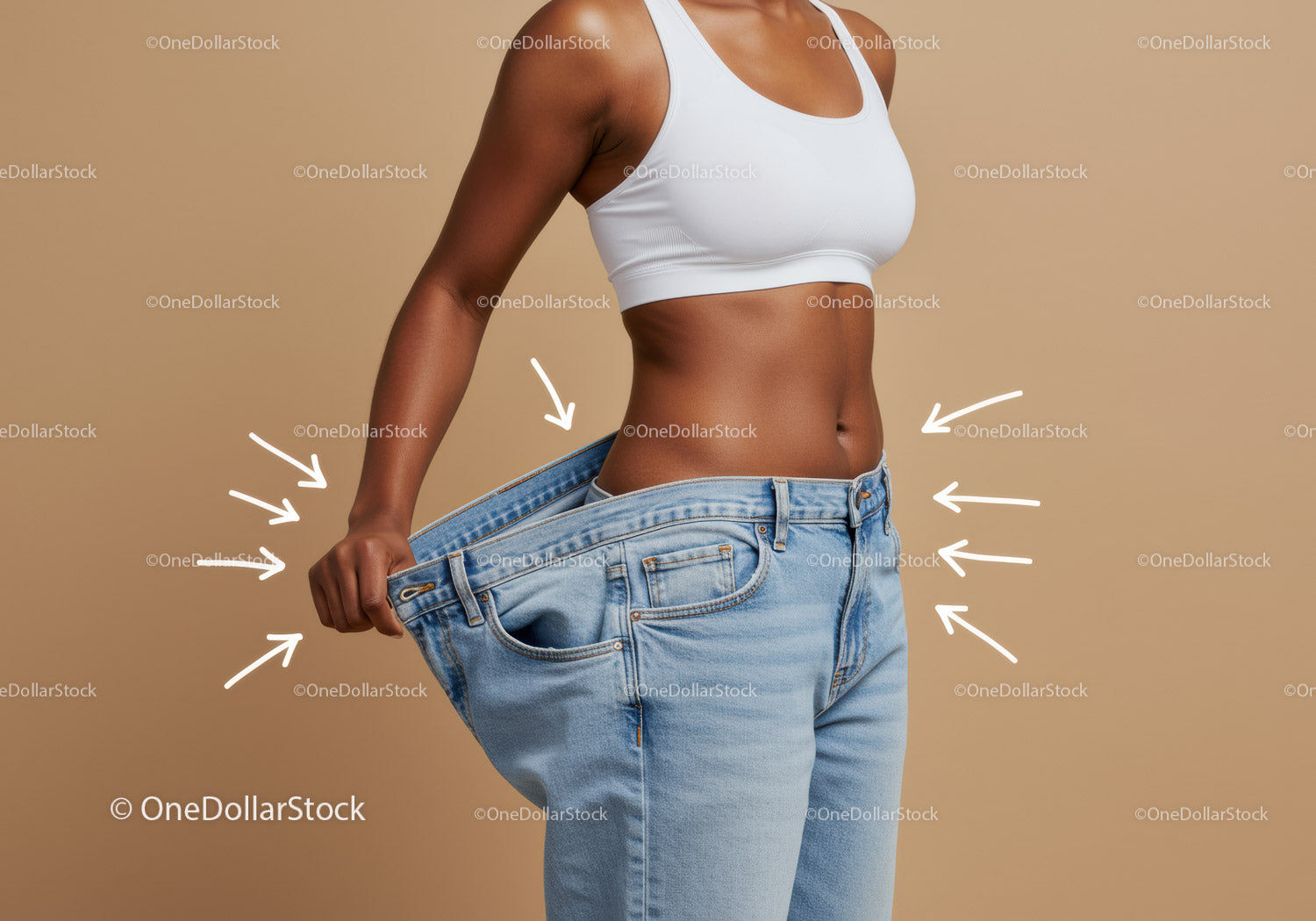 Woman Holding Oversized Jeans Indicating Weight Loss and Transformation