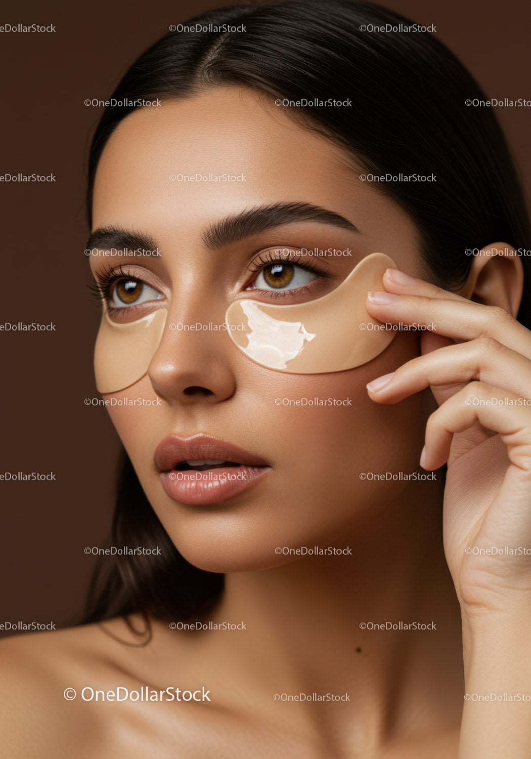Young Woman Applying Under-Eye Patches for Skin Rejuvenation