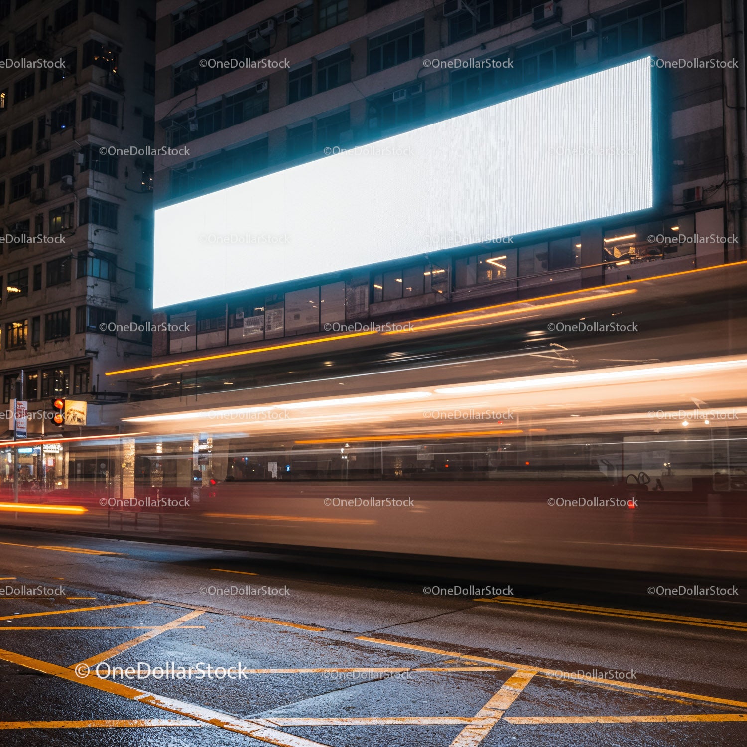 City street with bright billboard and light trails at night