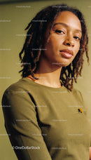 Confident young woman with natural hairstyle looking ahead