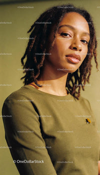 Confident young woman with natural hairstyle looking ahead