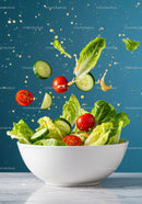 Fresh garden salad with tomatoes and cucumber splash