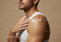 Male Applying Sunscreen Cream on Shoulder for Sun Protection
